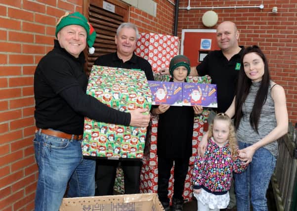 From left, Mick Balch, Paul Harris, William Balch and Steve Kibbey from L&S Waste Management with Catherine Booth House resident Jade Emptage, 22, and her daughter Scarlett-Rose Almy, three  

Picture: Sarah Standing (161719-9854)