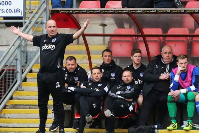 Pompey manager Paul Cook, left     Picture: Joe Pepler