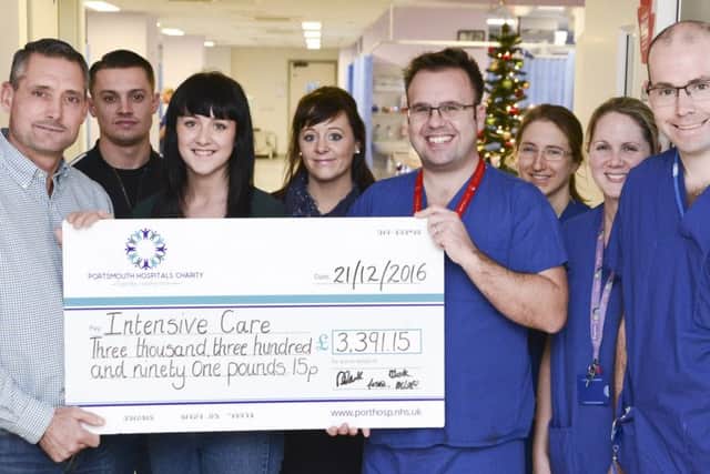 Darren Clark, left, and his family raised more than £3,000 for the intensive care unit at QA Hospital in memory of his partner Sharon