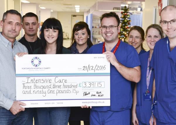 Darren Clark, left, and his family raised more than Â£3,000 for the intensive care unit at QA Hospital in memory of his partner Sharon