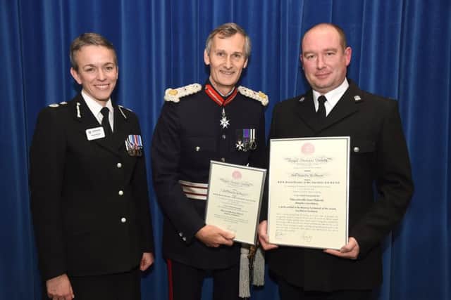Hampshire Chief Constable Olivia Pinkney, county Lord-Lieutenant Nigel Atkinson and PC Stuart Dickerson with his award