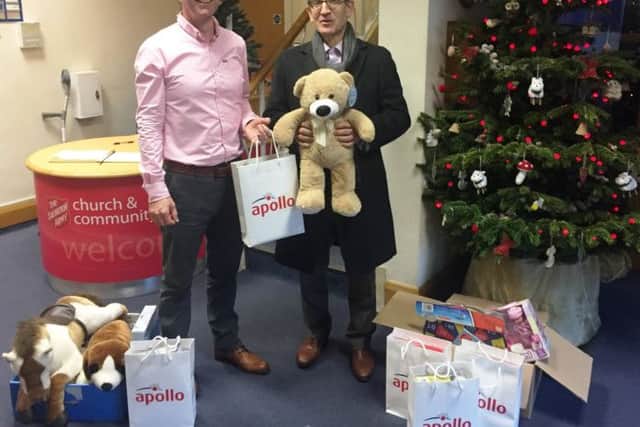 Apollo managing director Steve Brown, and Rob Warburton, community centre manager for The Haven at the Christmas gift presentation