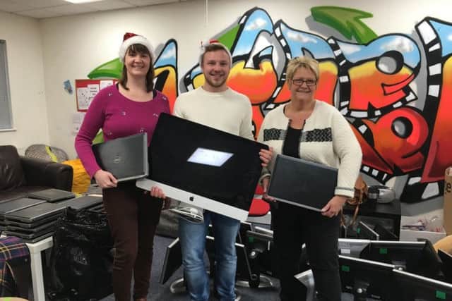 From left, Southampton Young Carers Project worker Hannah Moss, Koozai business development manager Darryl Silk, and young carers project worker  Julie Marron