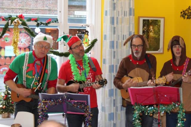 The Pompey Pluckers entertained after handing over a cheque for Â£8,100 to mental health charity Artscape