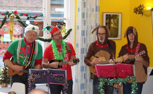 The Pompey Pluckers entertained after handing over a cheque for Â£8,100 to mental health charity Artscape