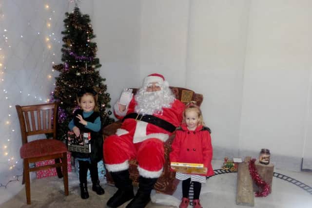 The Cross Keys landlord Kevin Stapley with Willow Cooper and Iris Parker, both three