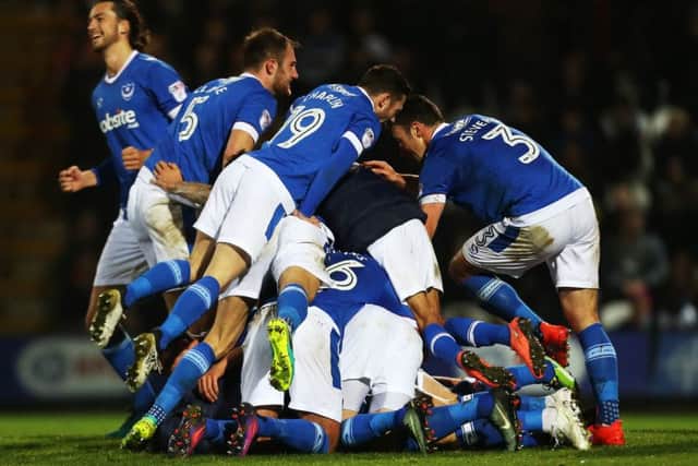 We have a football signed by the Pompey squad to give away
