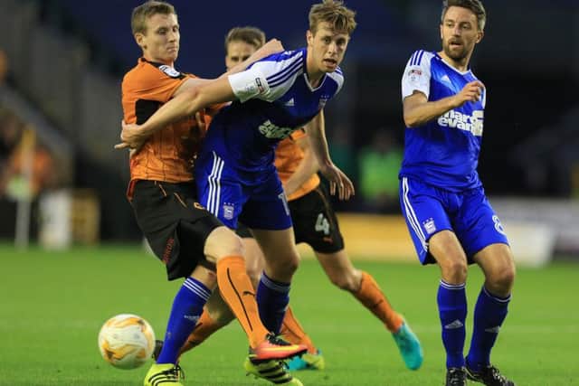 Former Pompey defender Adam Webster in action for Ipswich against Wolves this season