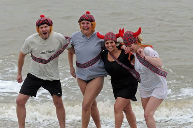 Brave souls take part in the 2016 New Year's Day swim
