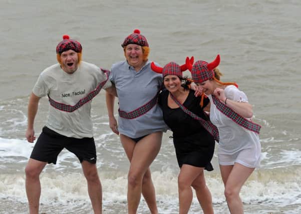 Brave souls take part in the 2016 New Year's Day swim