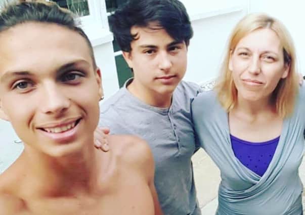 Cristina Goran with her two sons Adrian, 16, and Alex, 15