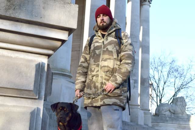 Russell Allen, 29, with his dog Lexi.  Picture: Loughlan Campbell PPP-161229-150312001