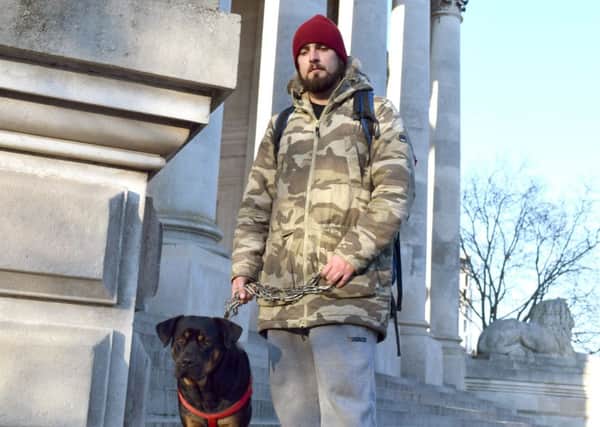 Russell Allen, 29, with his dog Lexi.  Picture: Loughlan Campbell PPP-161229-150312001
