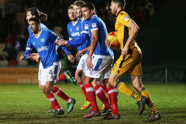 Danny Rose, left, celebrates after kickstarting Pompey's stunning Boxing Day comeback win over Newport County - his former club Picture: Joe Pepler