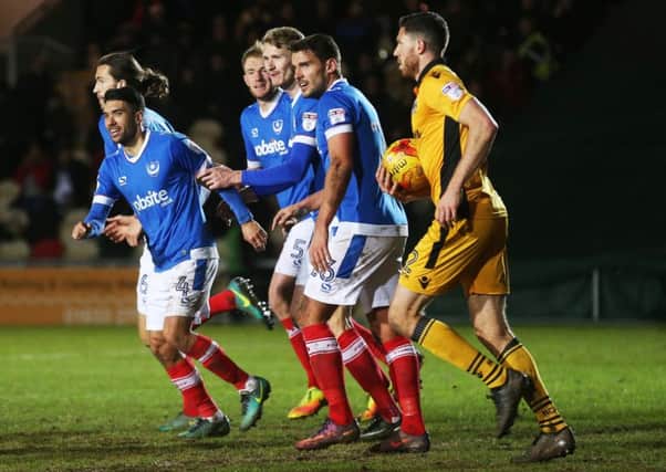 Danny Rose, left, celebrates after kickstarting Pompey's stunning Boxing Day comeback win over Newport County - his former club Picture: Joe Pepler