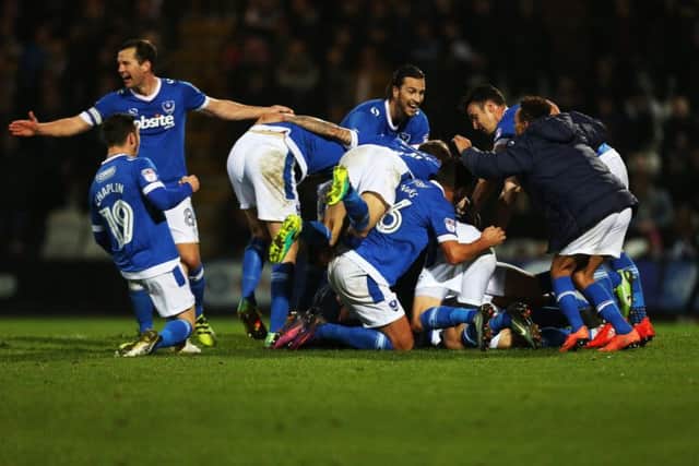 Pompey celebrate their late winner at Grimsby Town Picture: Joe Pepler