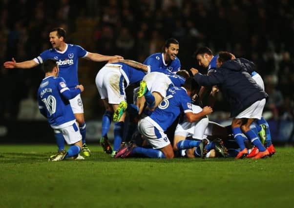 Pompey celebrate their late winner at Grimsby Town Picture: Joe Pepler