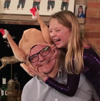 Oliver Stoner with his daughter Ruby - the winner of the One Christmas Day photo competition