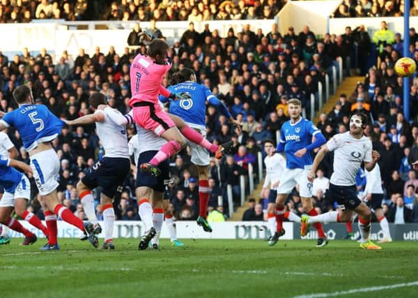 Christian Burgess scores with a header in the first half Picture: Joe Pepler