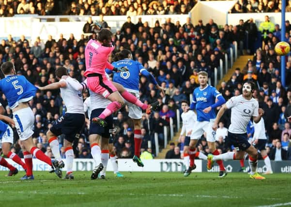 Christian Burgess scores the winner for Pompey with a first-half header Picture: Joe Pepler