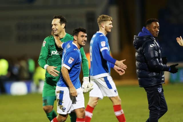 Pompey players celebrate victory over Luton Picture: Joe Pepler