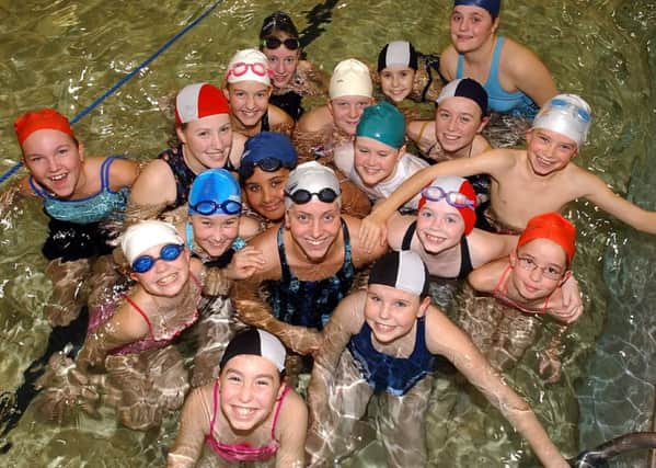 Former world champion Katy Sexton joins the 7th Cosham Girl Guides on their 1,700 length swim of Springfield School Pool in 2003