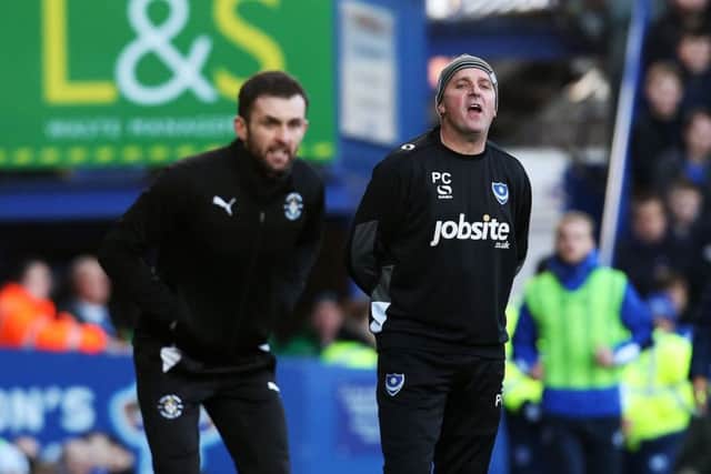 Pompey boss Paul Cook, right, got the better of Luton counterpart Nathan Jones    Picture: Joe Pepler
