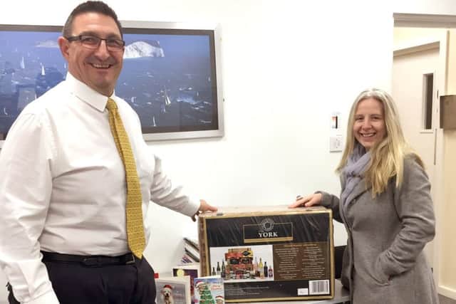 Claire Morgan, from Havant, collecting her prize from Meridian shopping centre manager Rob Fryer