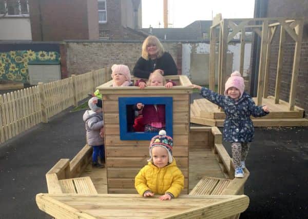 Mindy Butler with some of the children at The Brambles Nursery, in Southsea