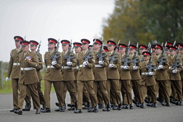 Soldiers of the 16th Regiment Royal Artillery parade at Thorney Island