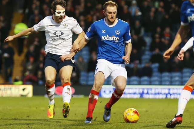 Pompey defender Matt Clarke, right, in action against Luton recently Picture: Joe Pepler