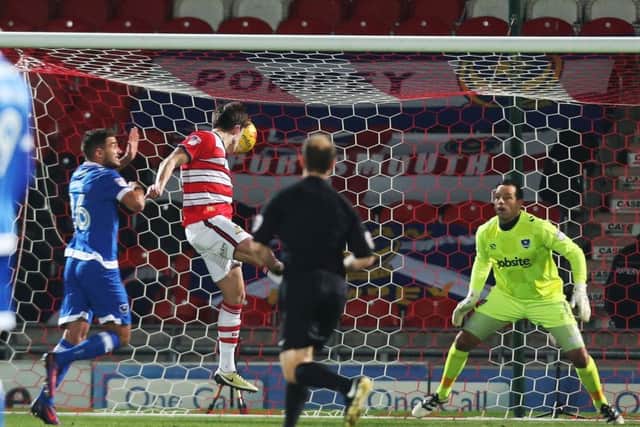John Marquis scores the opening goal. Picture: Joe Pepler