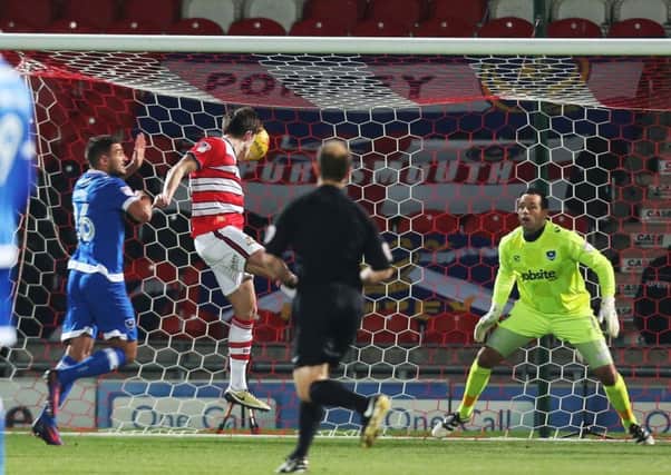 John Marquis scores the opening goal. Picture: Joe Pepler
