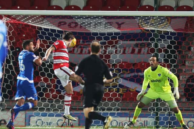John Marquis opens the scoring for Doncaster. Picture: Joe Pepler