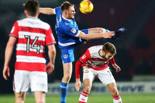 Matt Clarke in action for Pompey against Doncaster Picture: Joe Pepler