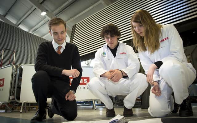 From left,  James Scott, Robbie North and Hannah-Lea Barber - apprentices at BAE Systems' Cowes site  Picture: BAE Systems