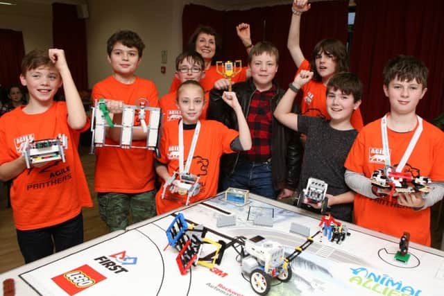 Pupils celebrate as they have won First Lego League Challenge. From the left are George Mapp 11, Jamie White 11, Lottie Conlin 11, Thomas Bruderer 11 Cameron Read 11, Daniel Robinson 12, Morgan Pierce, George Hinds 11 and Liz Stoneham at the back									 Pictures: Habibur Rahman