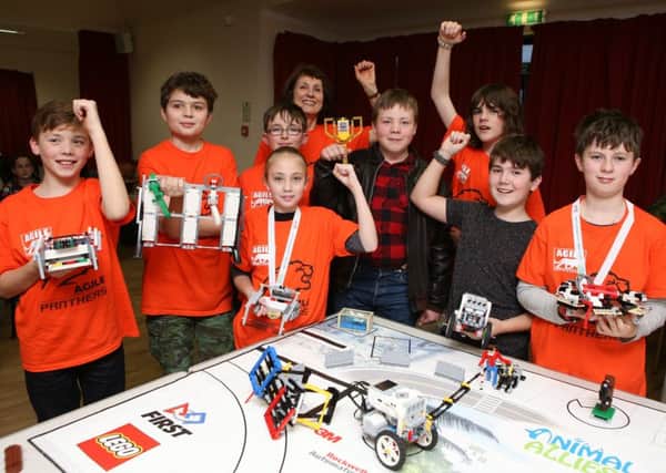 Pupils celebrate as they have won First Lego League Challenge. From the left are George Mapp 11, Jamie White 11, Lottie Conlin 11, Thomas Bruderer 11 Cameron Read 11, Daniel Robinson 12, Morgan Pierce, George Hinds 11 and Liz Stoneham at the back									 Pictures: Habibur Rahman