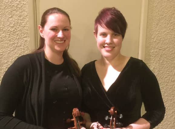 Violinists Louise Holmes, left, and Jen Ansari