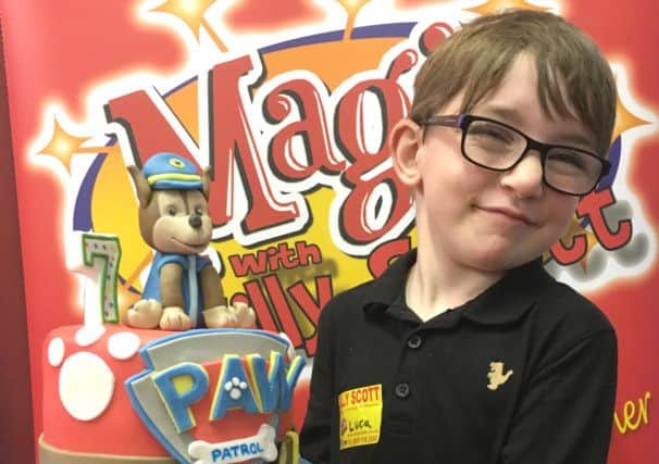 Birthday boy Luca McGee with his PAW Patrol cake