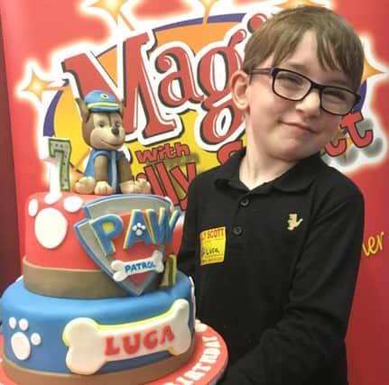 Birthday boy Luca McGee with his PAW Patrol cake