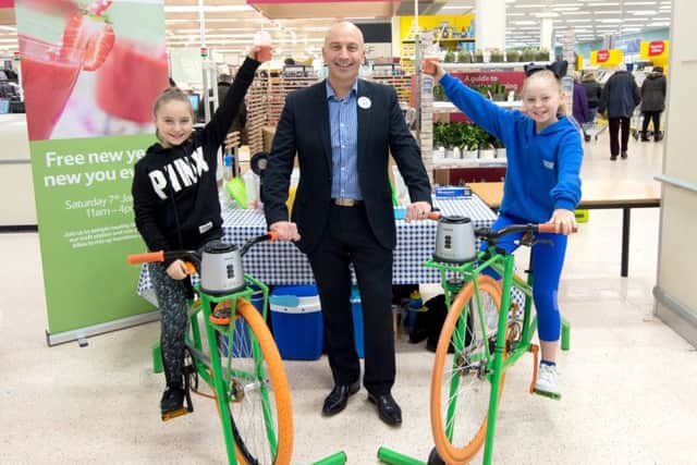 West End child stars Dior and Envi Bedford pictured with store manager Paul Cavaliere. Picture: Julian Porter Photography