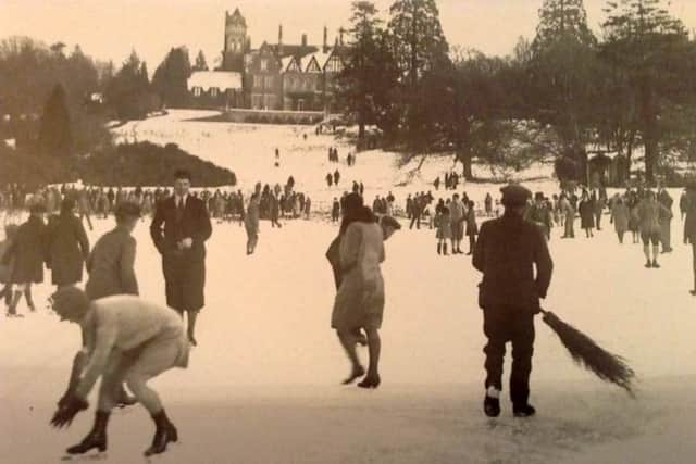 WINTER SPORTS Skaters on the lake in Leigh Park Gardens with the house on the bank in the distance