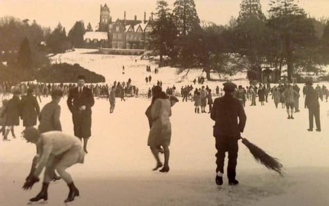 WINTER SPORTS Skaters on the lake in Leigh Park Gardens with the house on the bank in the distance