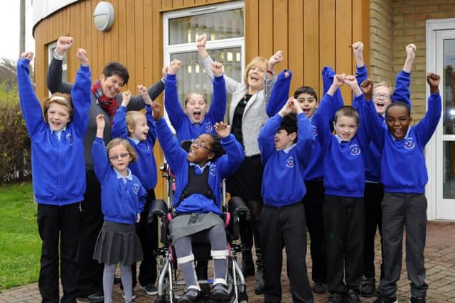 Cliffdale Primary Academy's hHead of school Ashley Oliver-Catt and executive headteacher Alison Beane with children celebrating their 'outstanding' Ofsted rating Picture: Malcolm Wells (170109-4446)