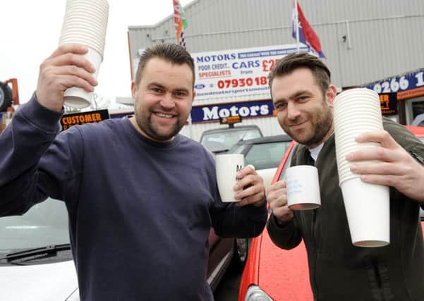 Danny O'Reilly, 38, left and Tony Clemnents, 30, of North End Motors in London Road North End, Portsmouth 

Picture:  Malcolm Wells (170109-4547)