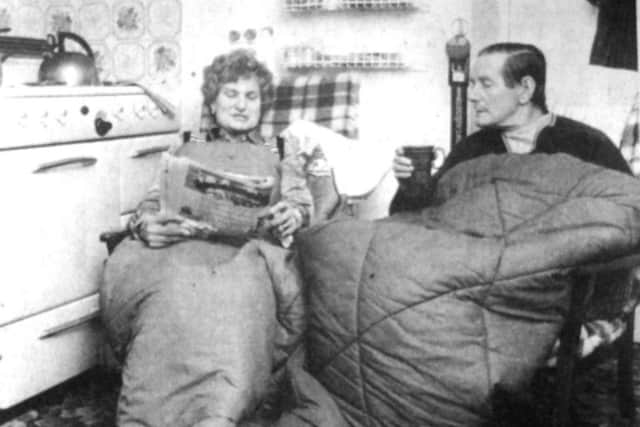 Leonard Harris and his wife Vera prepare to move on to a new council residence, after they had been forced to live and sleep in their kitchen after the gable end of their house was destroyed by the weather (6246-1)