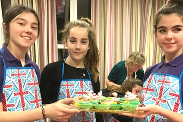 Girls Brigade members with their winning cakes