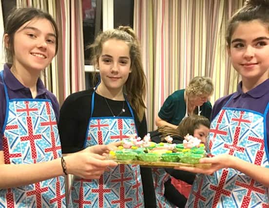 Girls Brigade members with their winning cakes