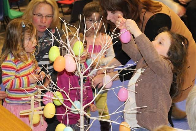 Families enjoy art and craft at the tea service